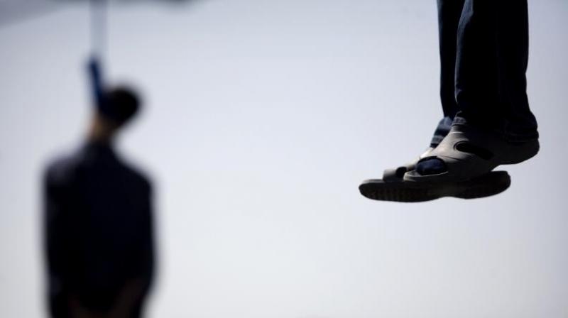 In Bengaluru - Teenage girl films father hanging son to death